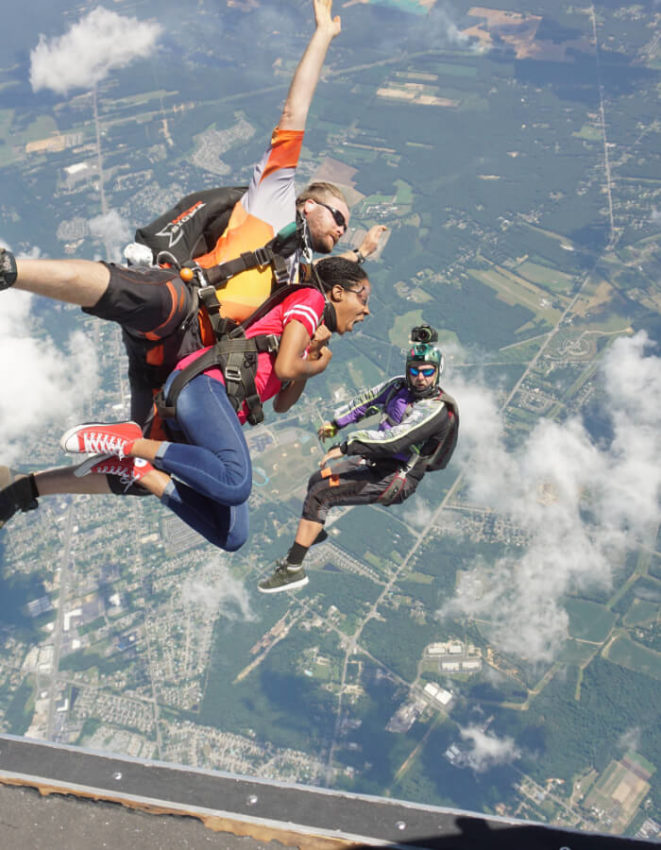 Skydivers jumping out plane.